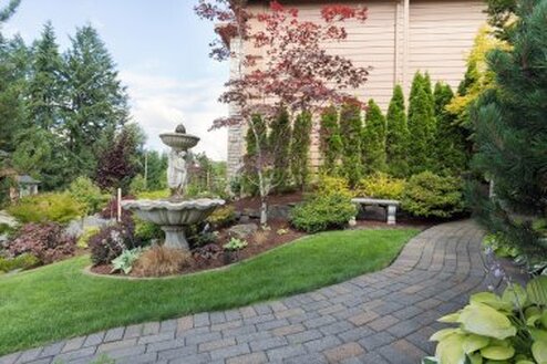 pavers and water fountain in yard